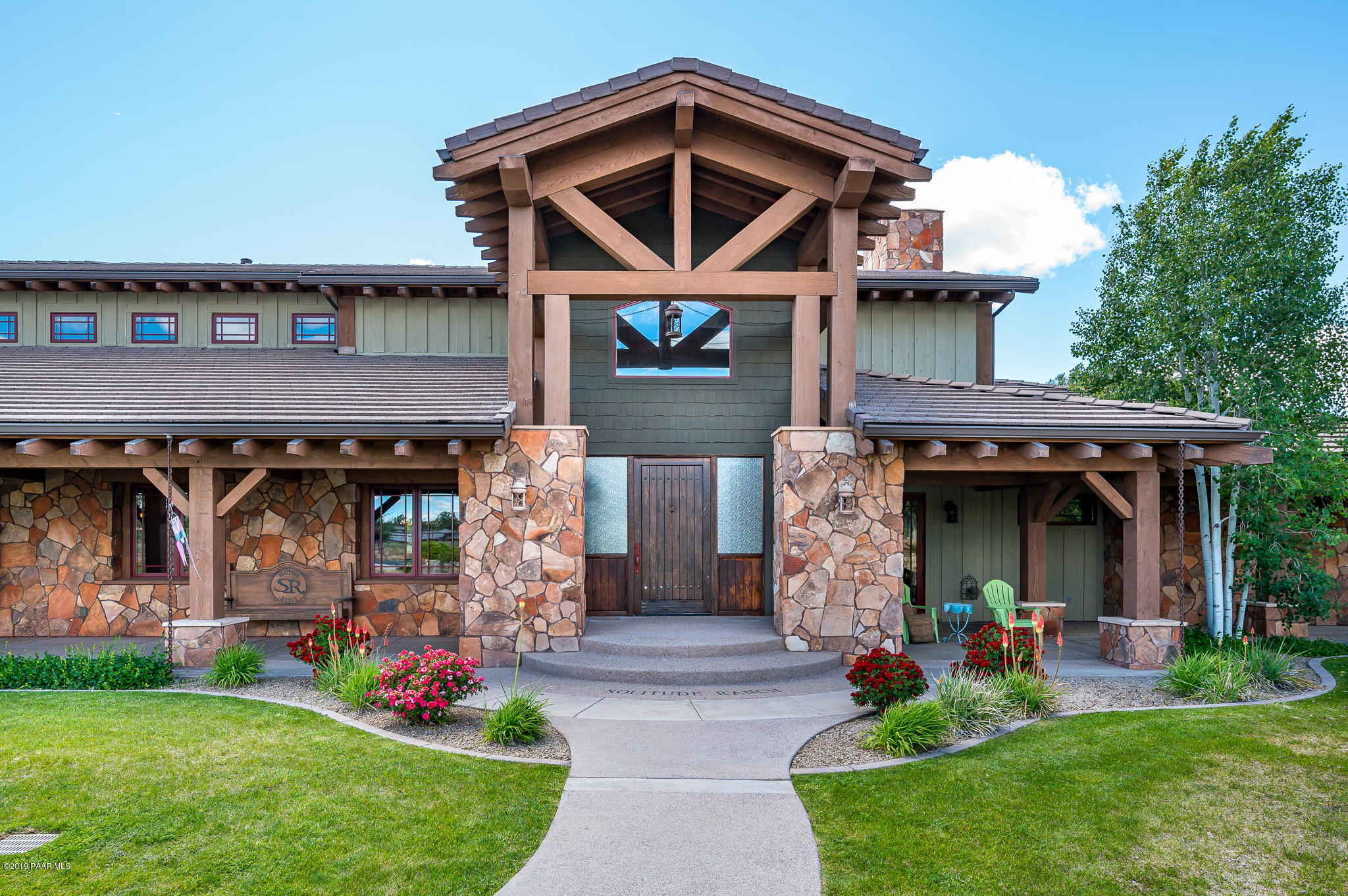 9120 North American Ranch Road Prescott, AZ 86305 - Photo 3 of 66 a front view of a house with garden