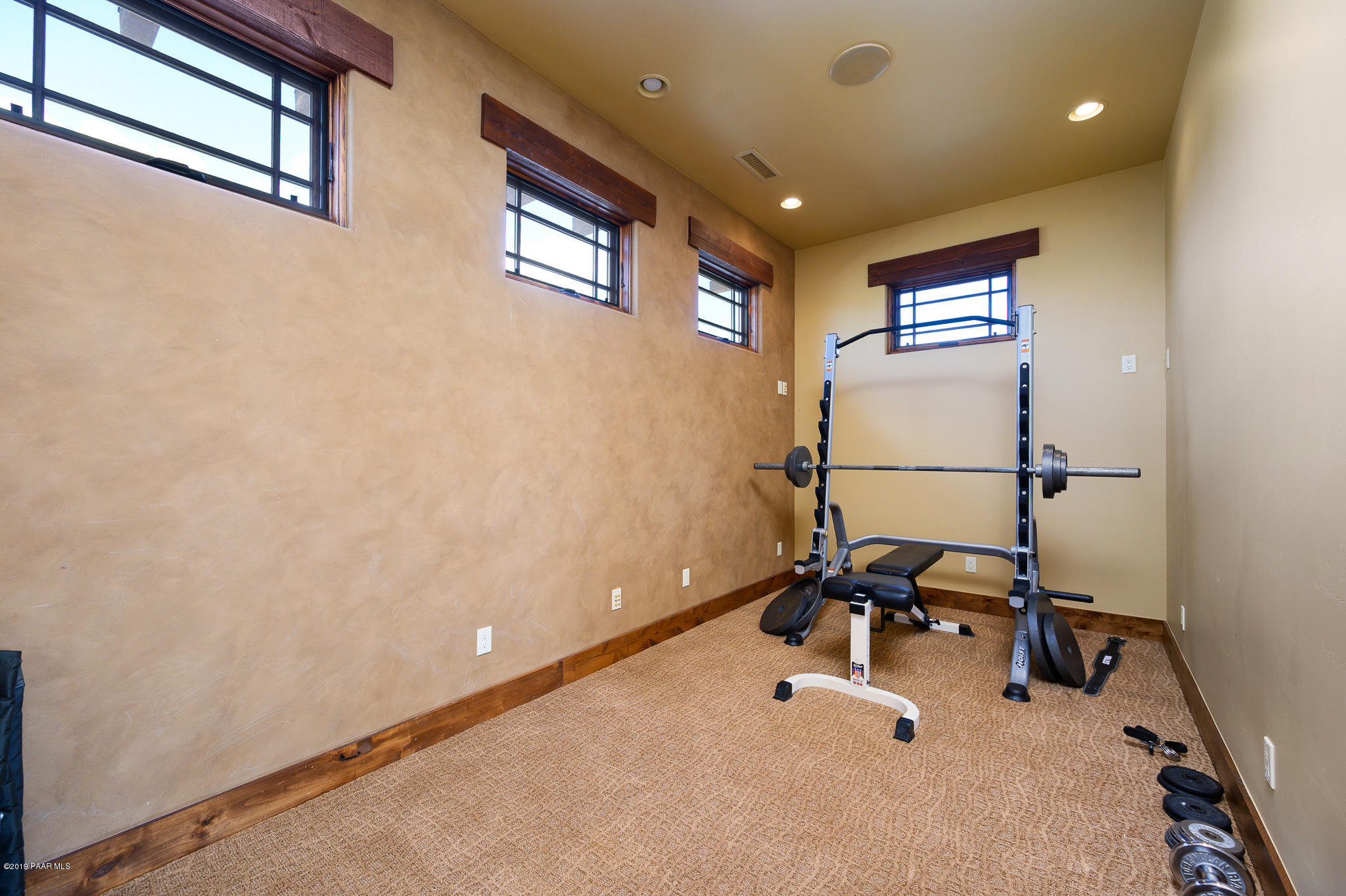 9120 North American Ranch Road Prescott, AZ 86305 - Photo 33 of 66 a room with gym equipment and a view of living room