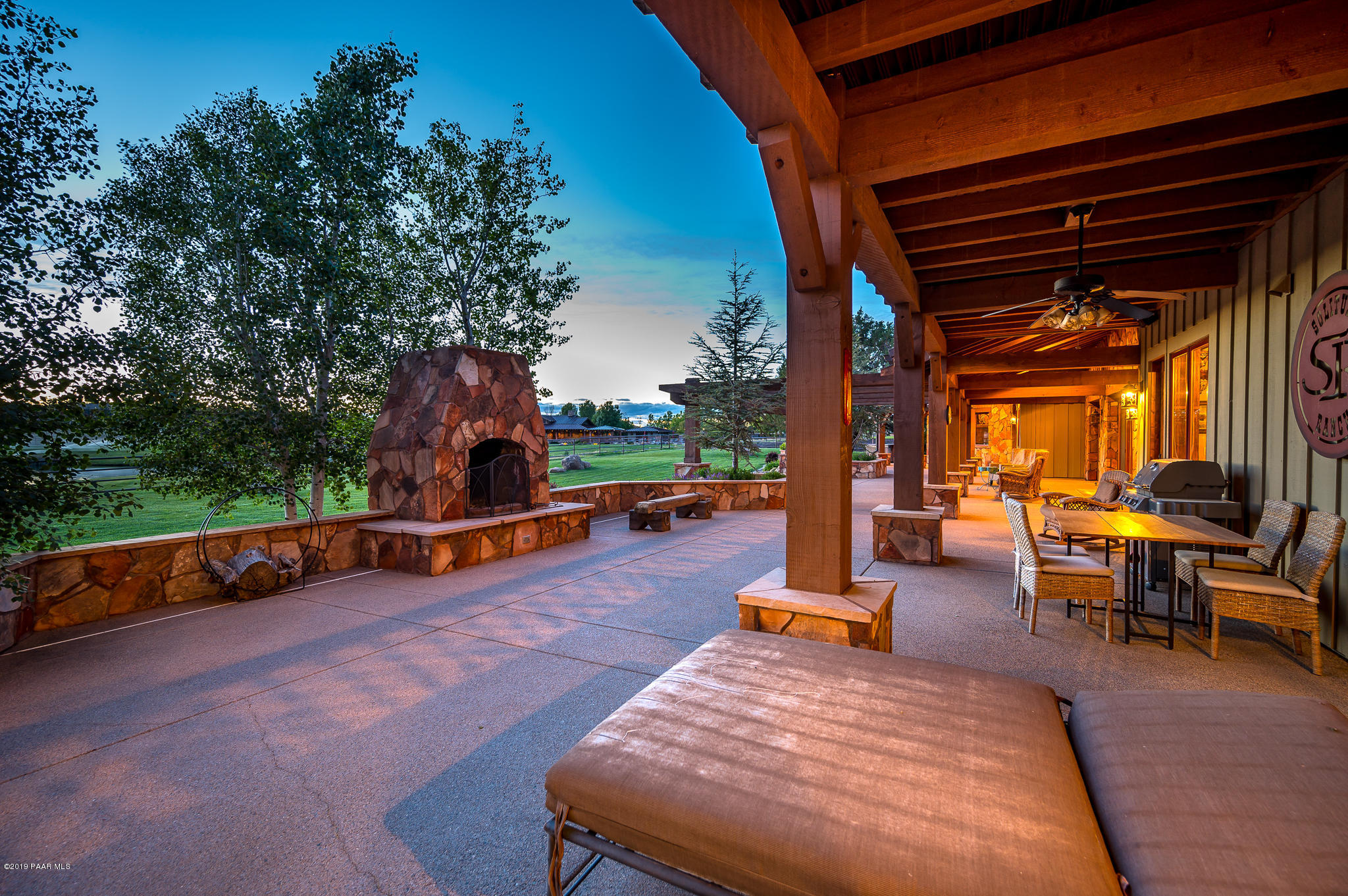 9120 North American Ranch Road Prescott, AZ 86305 - Photo 34 of 66 an outdoor sitting area with couch and wooden fence