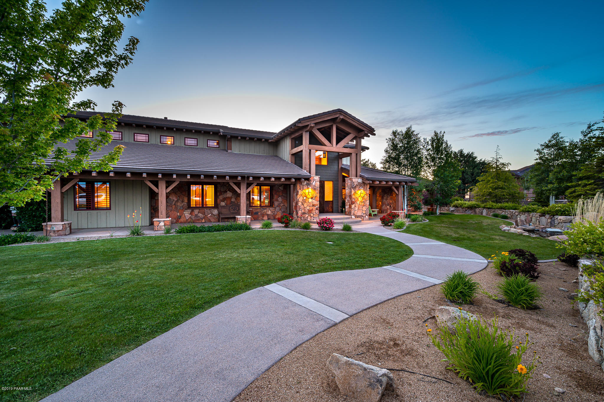 9120 North American Ranch Road Prescott, AZ 86305 - Photo 4 of 66 a front view of a house with a yard