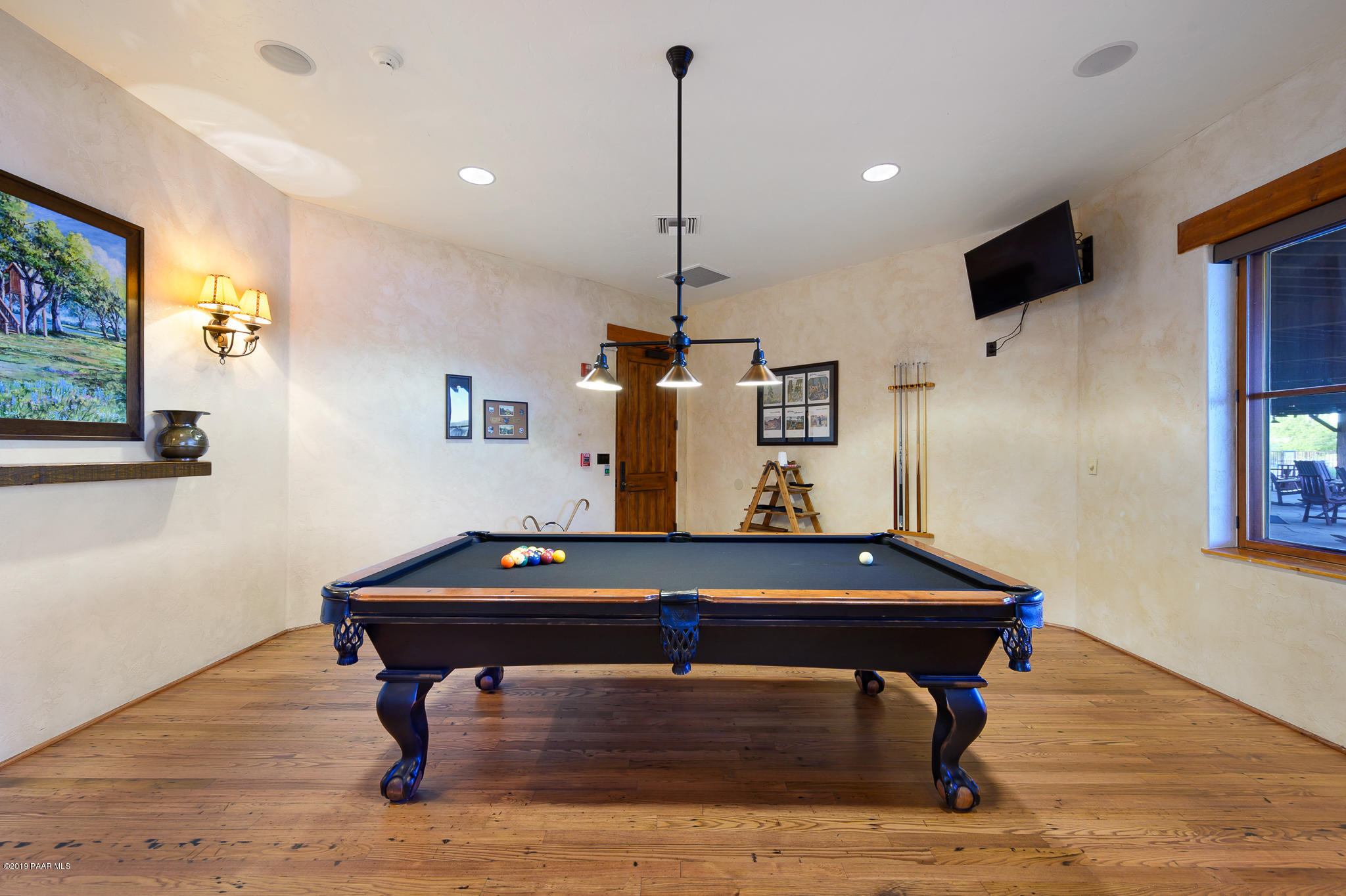 9120 North American Ranch Road Prescott, AZ 86305 - Photo 57 of 66 a room with table chairs and wooden floor