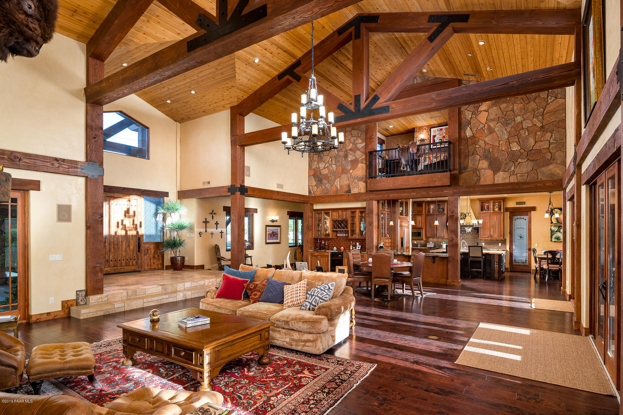 9120 North American Ranch Road Prescott, AZ 86305 - Photo 9 of 66 a living room with lots of furniture and a chandelier