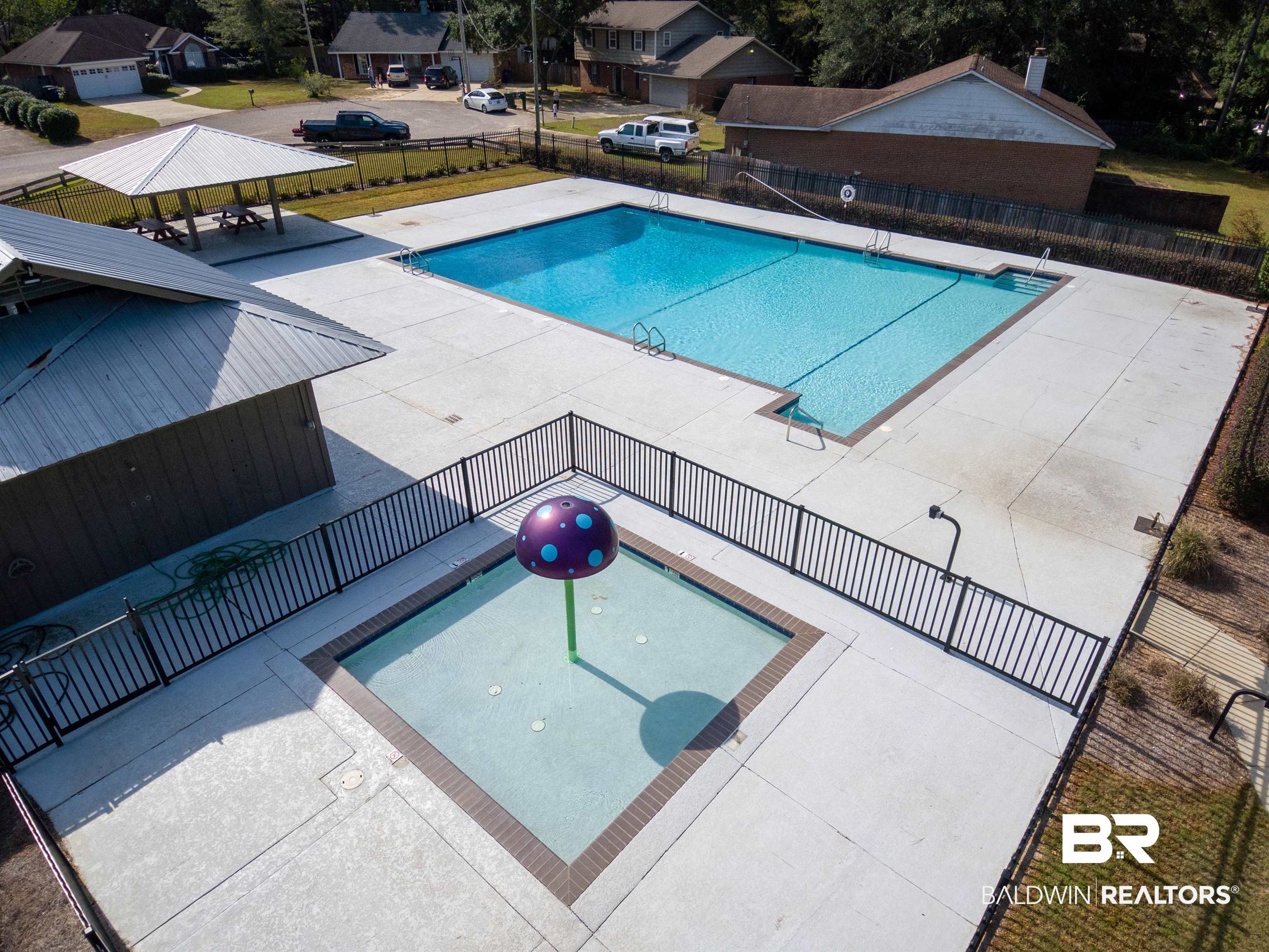 209 Montclair Loop Daphne, AL 36526 - Photo 53 of 55 Community pool featuring fence, a patio area, and a residential view