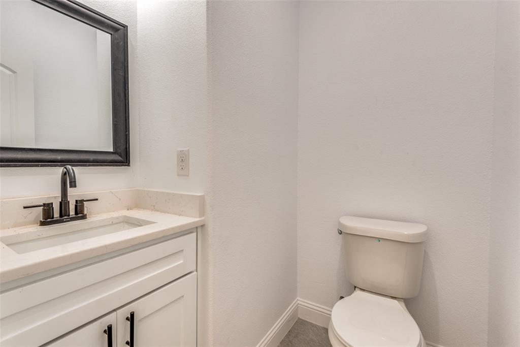 1563 Milam Street Fort Worth, TX 76112 - Photo 8 of 12 Bathroom with vanity and toilet