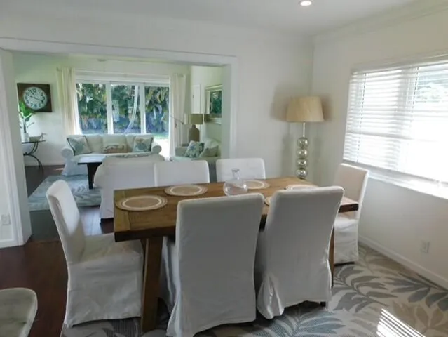 a view of a dining room with furniture window and outside view