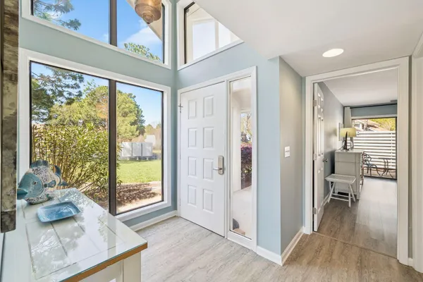 a view of a livingroom with furniture and front door