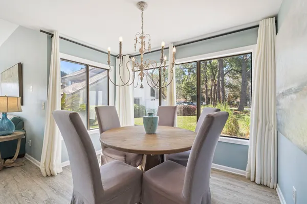 a view of a dining room with furniture window and wooden floor