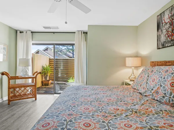 a bedroom with a bed and a dresser in it