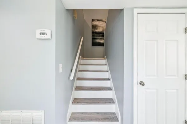 a view of staircase with white walls and white walls