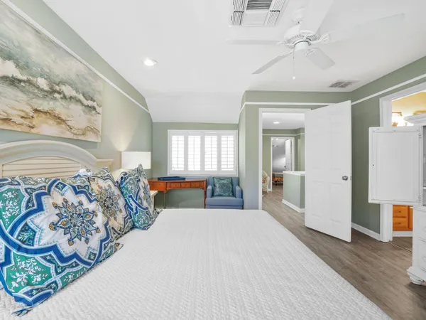 a bedroom with furniture and a chandelier