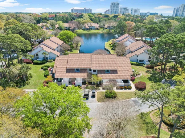 an aerial view of a house with pool and ocean view
