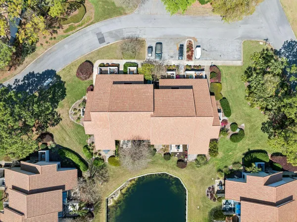 an aerial view of a house with outdoor space swimming pool