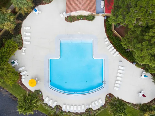 a view of a swimming pool with a yard