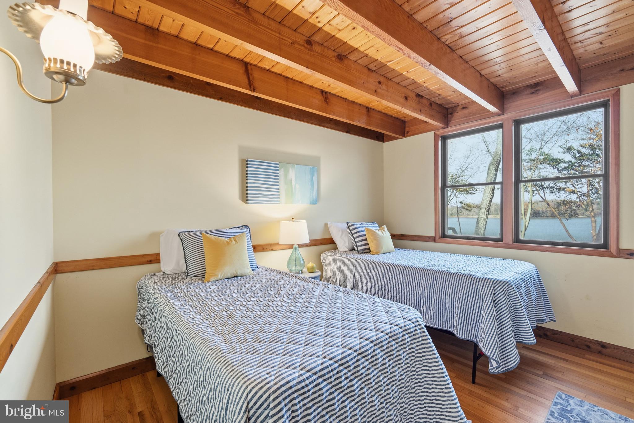 12400 Woods Road Worton, MD 21678 - Photo 12 of 29 a bedroom with bed and a large window