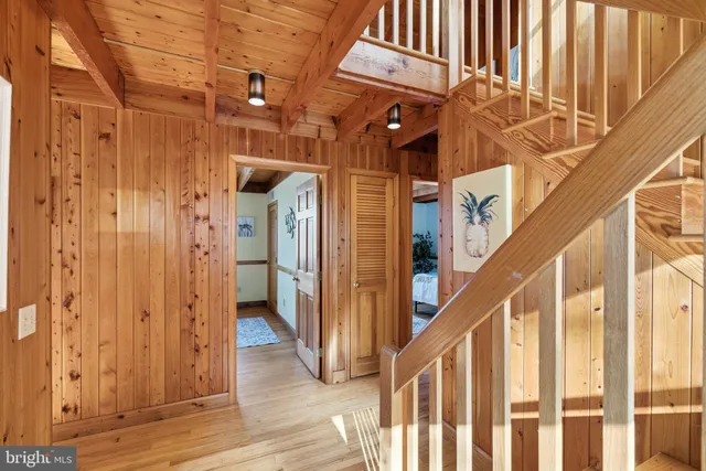 a bedroom with a bed and a tv