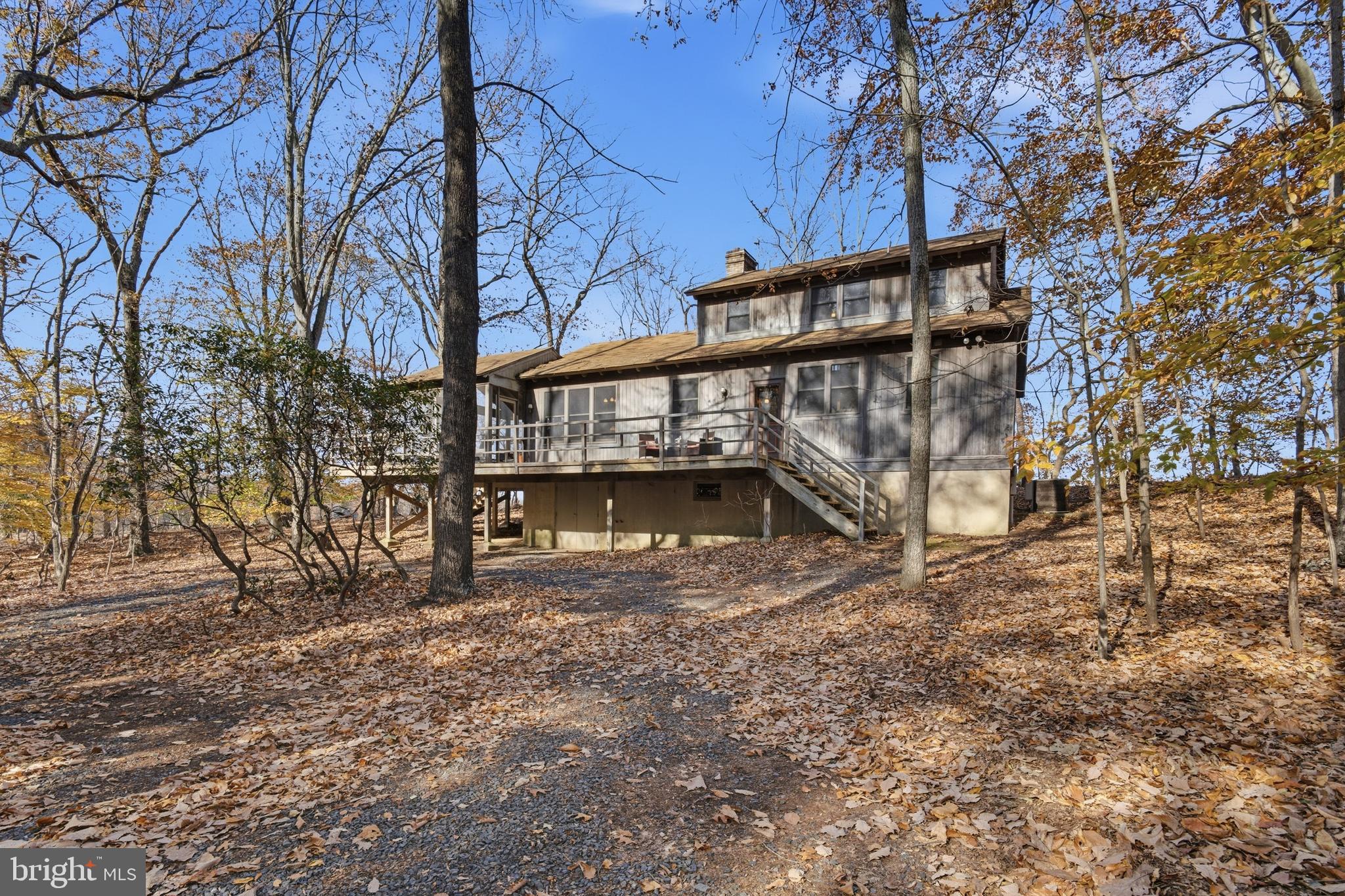 12400 Woods Road Worton, MD 21678 - Photo 25 of 29 a view of backyard with deck and a garden