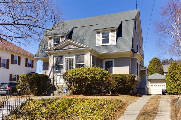 26 Jackson Road Medford, MA 02155 - Photo 1 of 25 a front view of a house with a yard