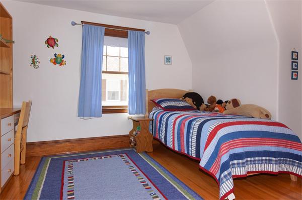 26 Jackson Road Medford, MA 02155 - Photo 11 of 25 a bedroom with a bed and a window