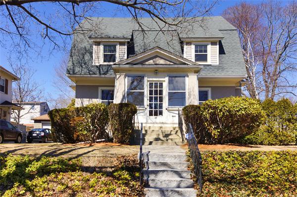 26 Jackson Road Medford, MA 02155 - Photo 22 of 25 a view of a house with a yard