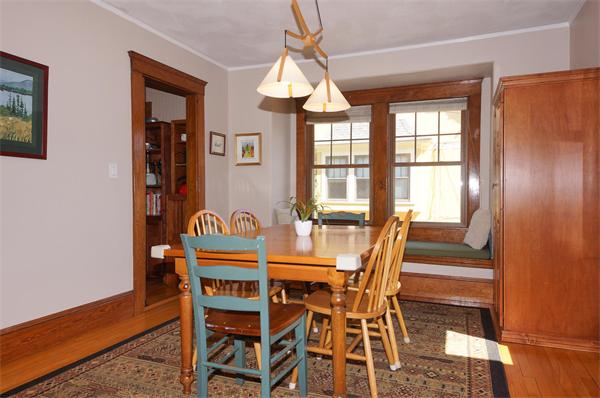 26 Jackson Road Medford, MA 02155 - Photo 4 of 25 a dining room with furniture a chandelier and wooden floor
