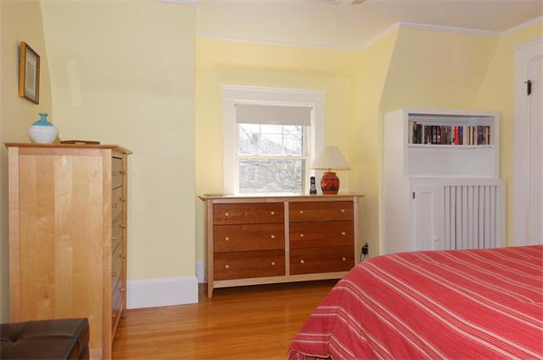 26 Jackson Road Medford, MA 02155 - Photo 9 of 25 a bedroom with a bed and a dresser