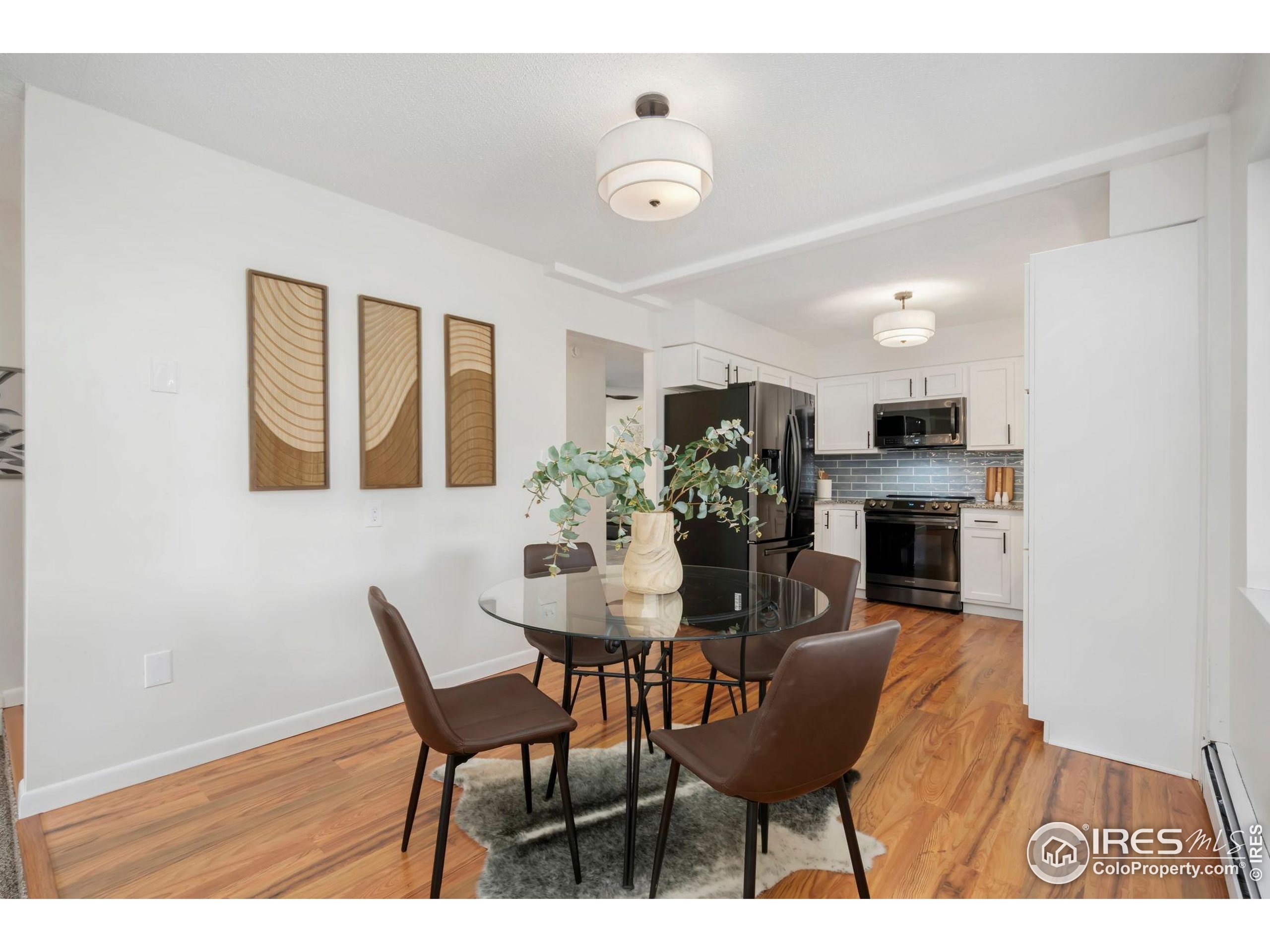 435 Birch Avenue Eaton, CO 80615 - Photo 11 of 32 a view of kitchen and dining area with furniture