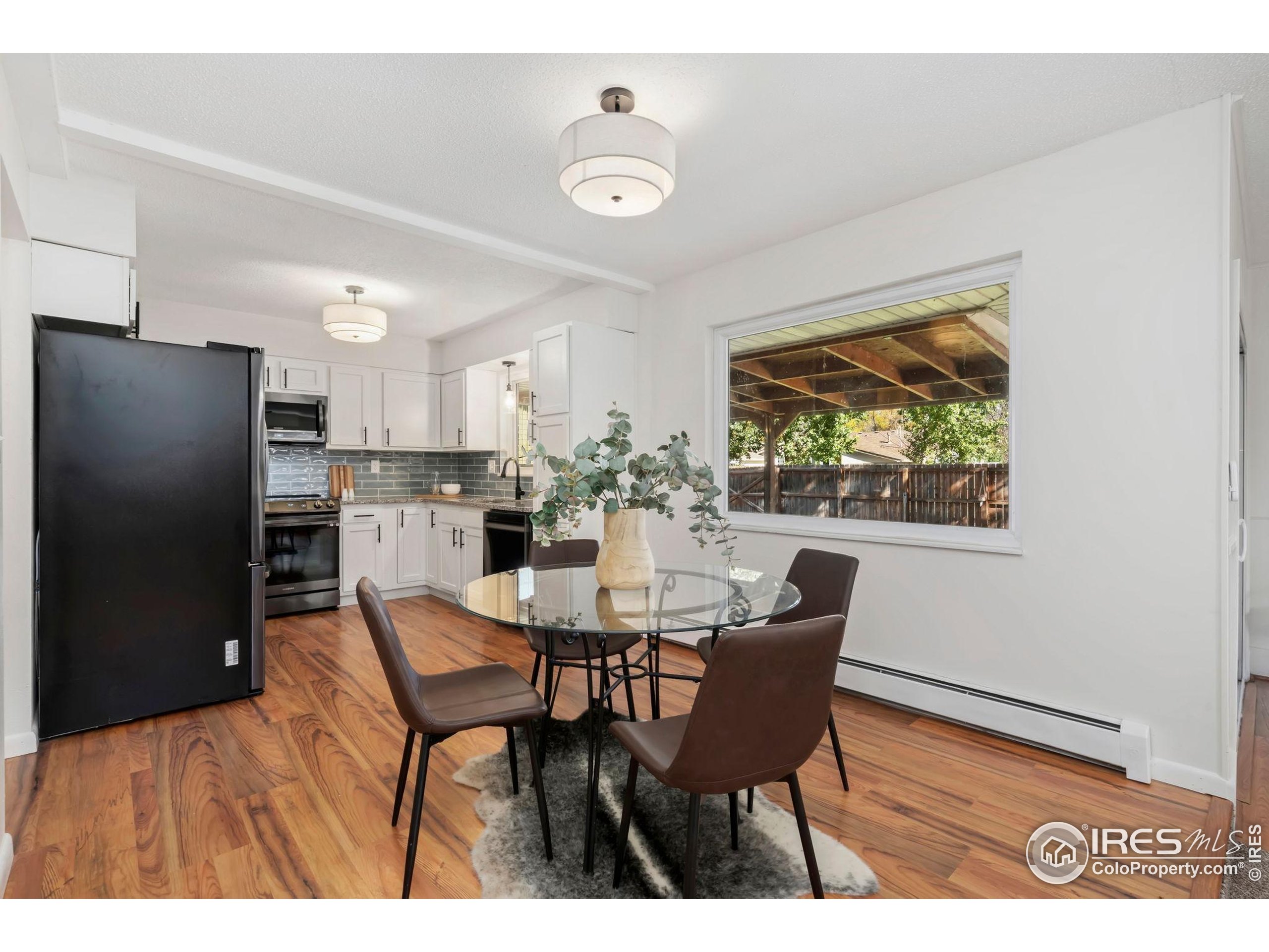 435 Birch Avenue Eaton, CO 80615 - Photo 12 of 32 a dining room with furniture and window
