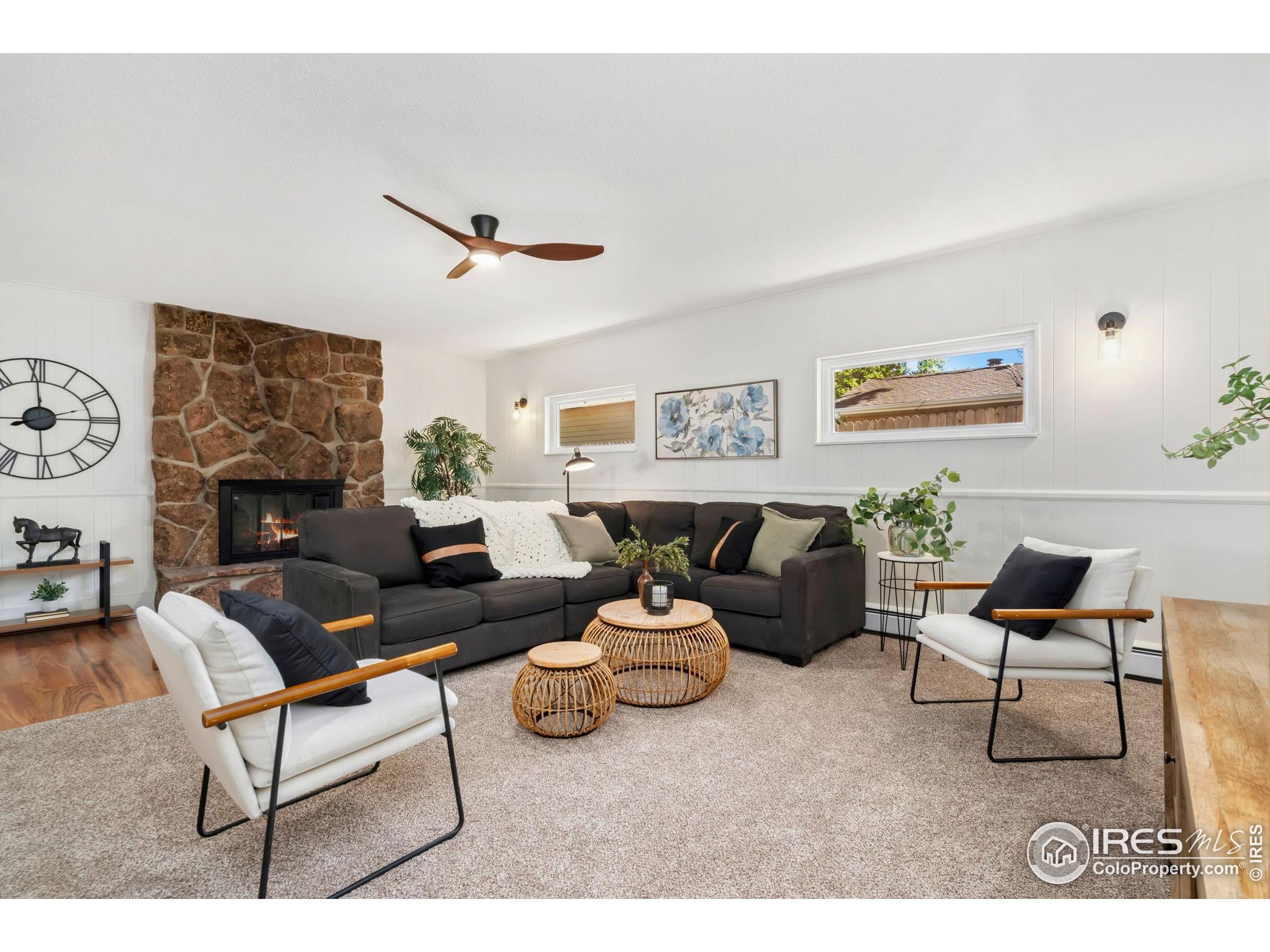 435 Birch Avenue Eaton, CO 80615 - Photo 14 of 32 a living room with furniture and a fireplace