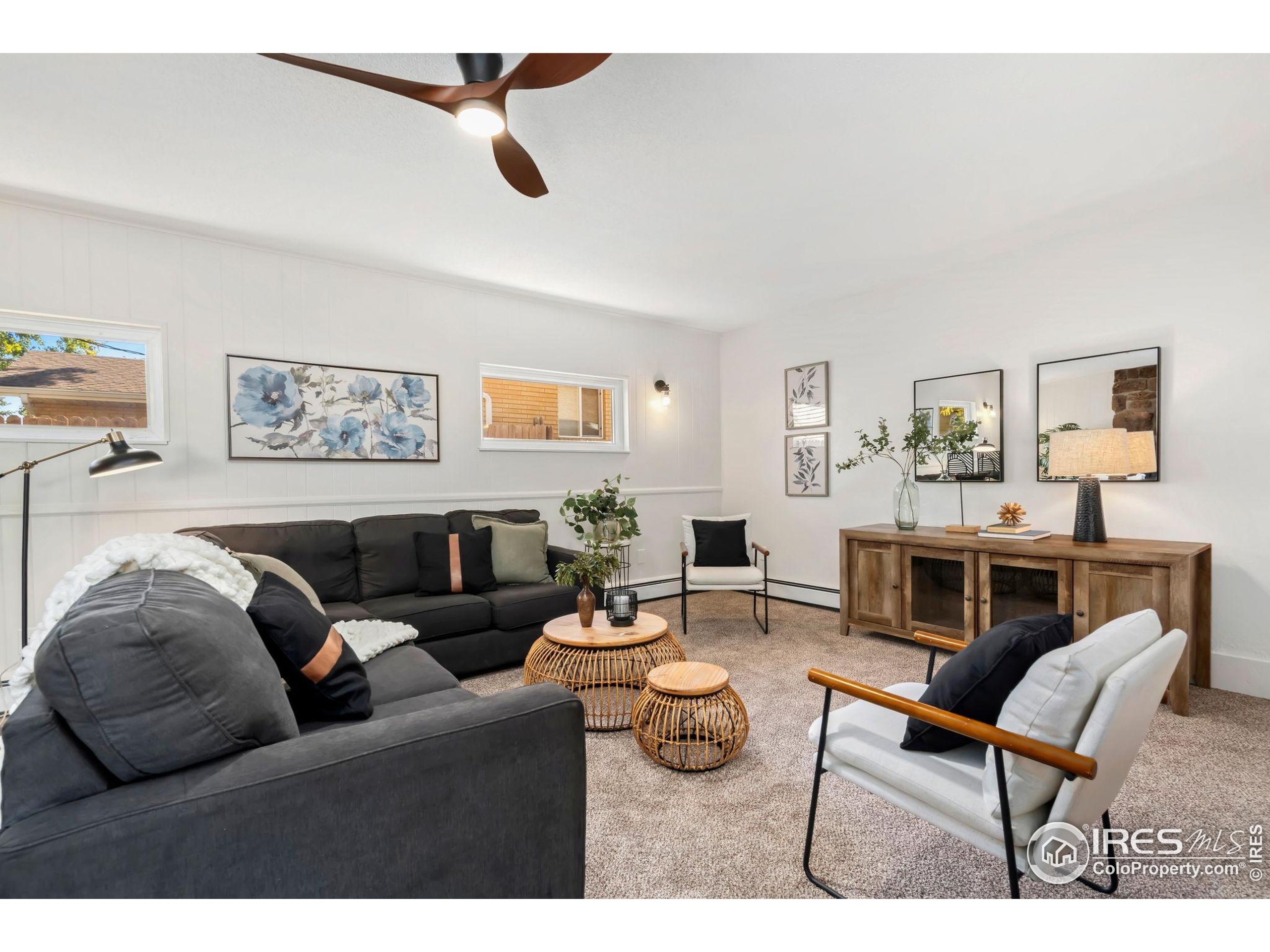 435 Birch Avenue Eaton, CO 80615 - Photo 15 of 32 a living room with furniture and a wooden floor