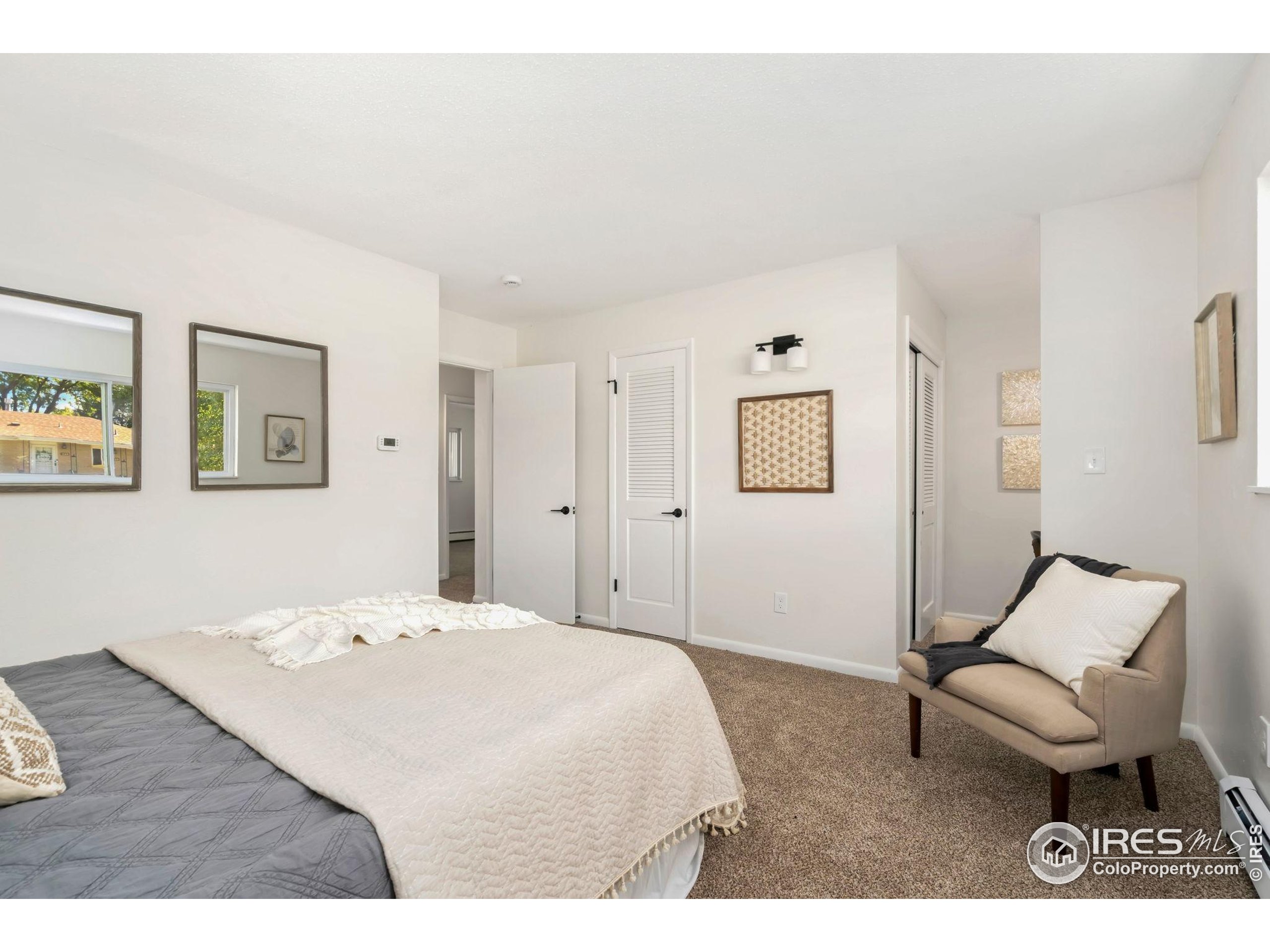 435 Birch Avenue Eaton, CO 80615 - Photo 18 of 32 a bedroom with a bed and furniture