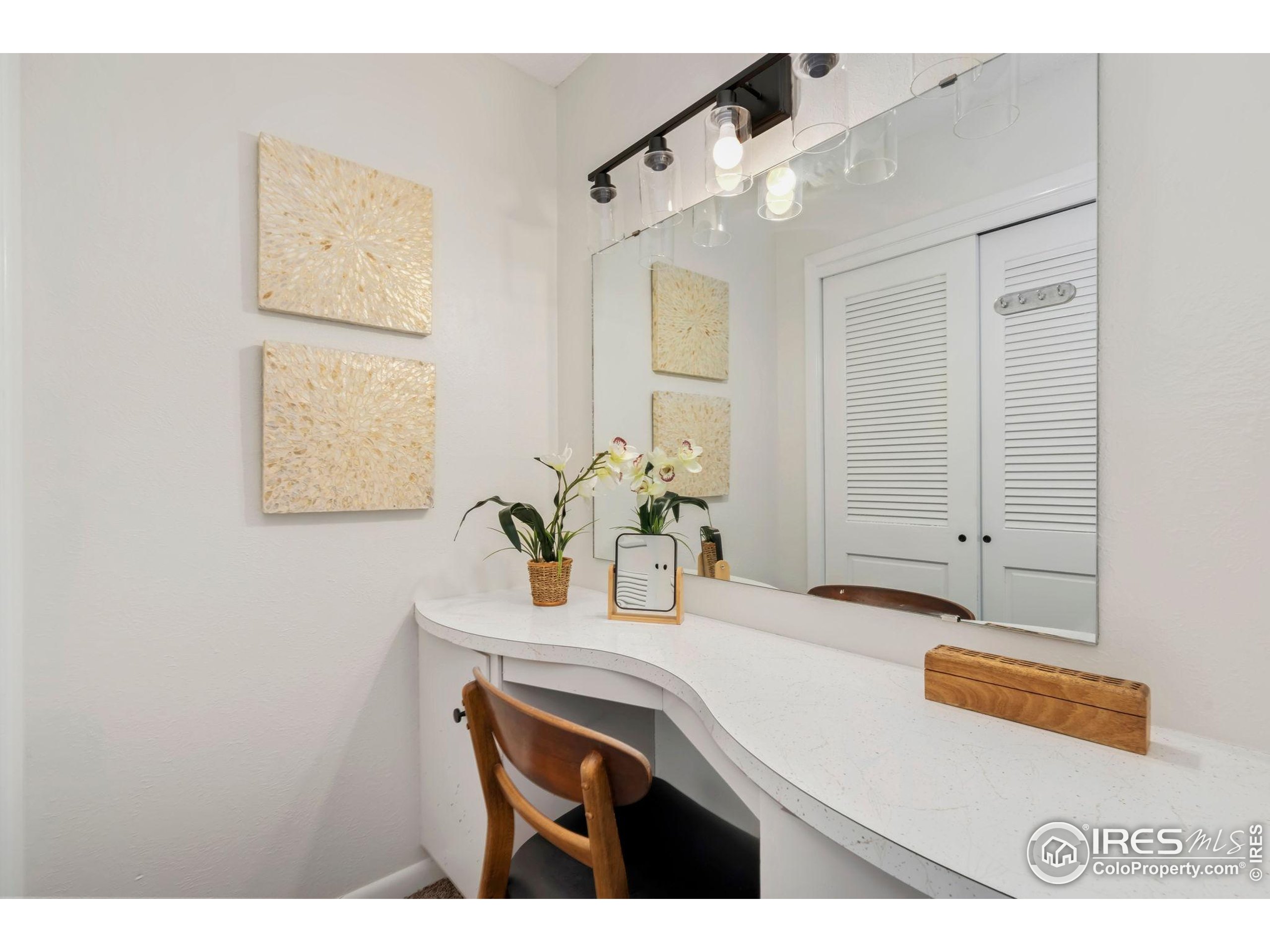435 Birch Avenue Eaton, CO 80615 - Photo 20 of 32 a room with a sink and a mirror
