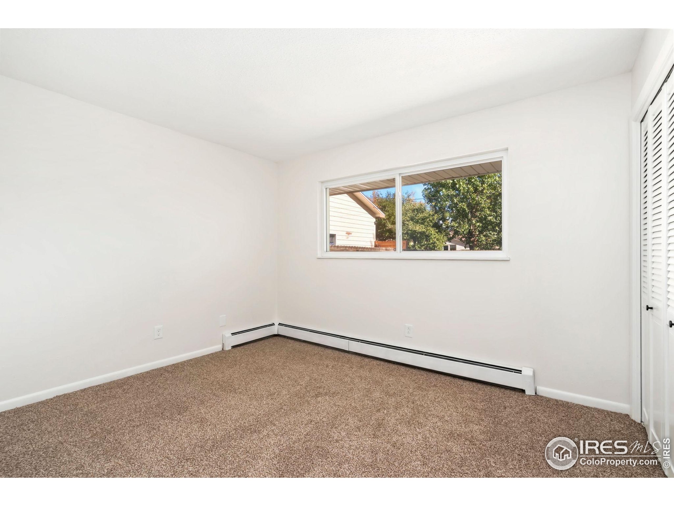 435 Birch Avenue Eaton, CO 80615 - Photo 25 of 32 an empty room with a window