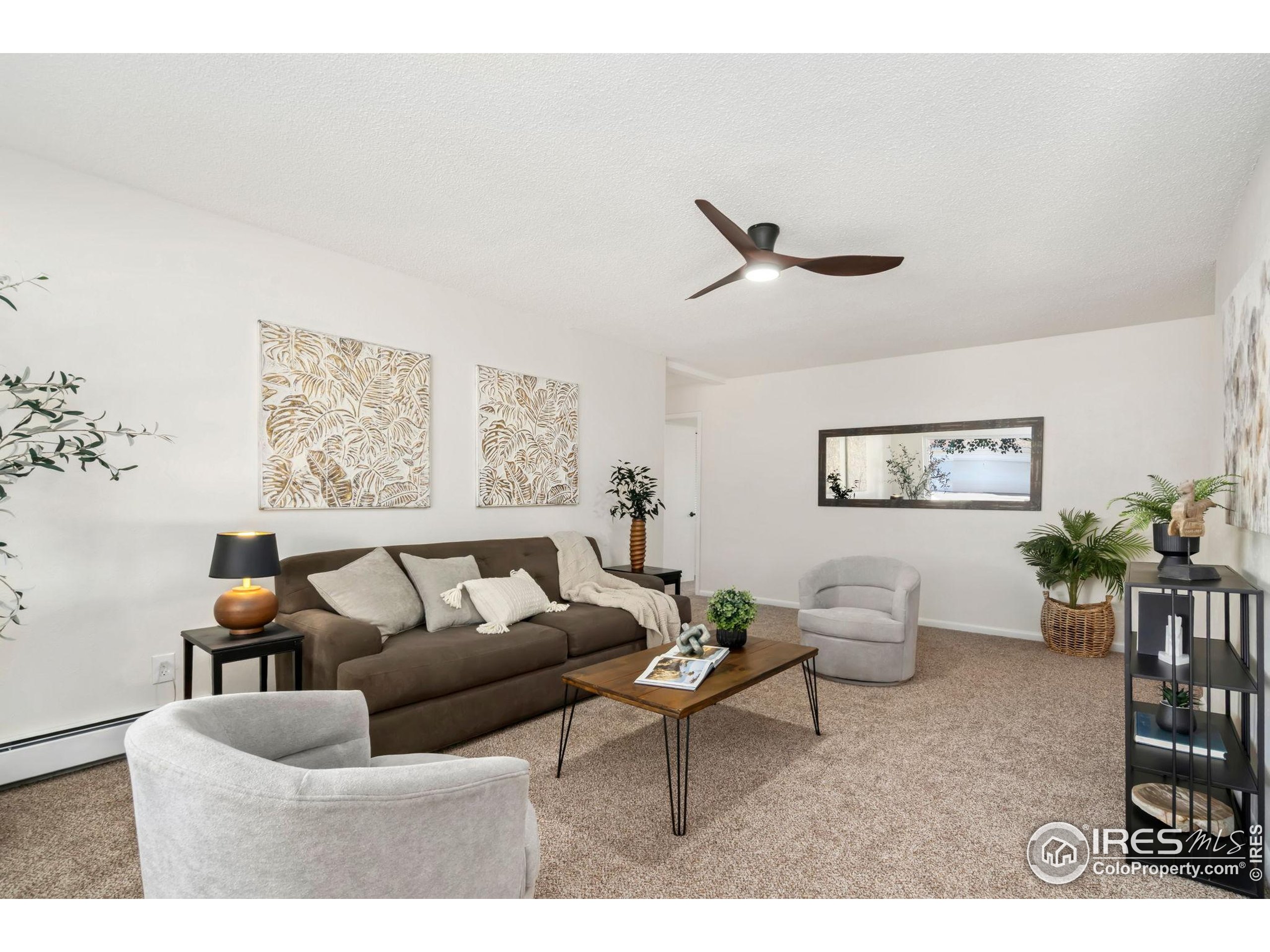 435 Birch Avenue Eaton, CO 80615 - Photo 3 of 32 a living room with furniture and a large window