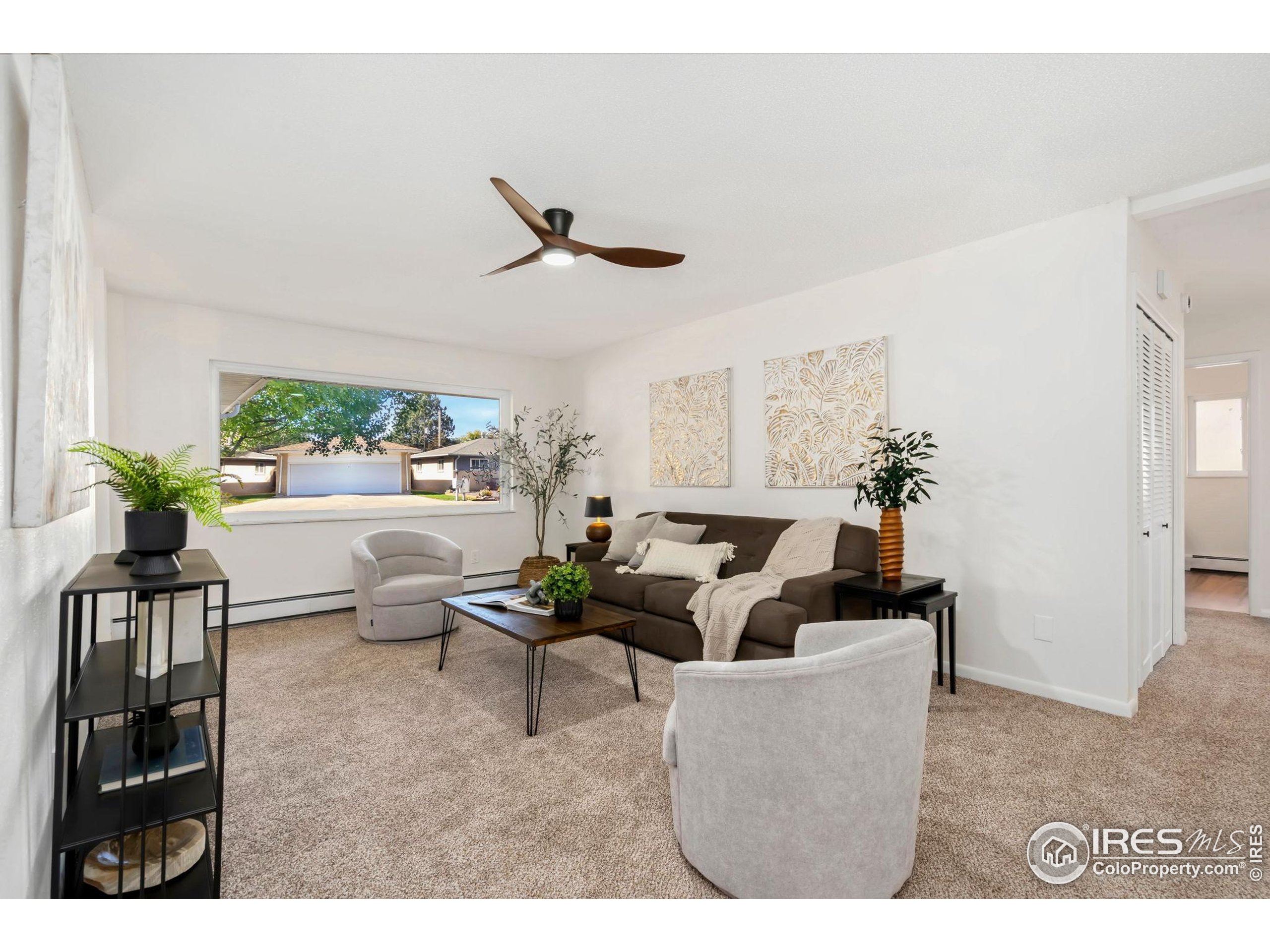 435 Birch Avenue Eaton, CO 80615 - Photo 5 of 32 a living room with furniture and a potted plant
