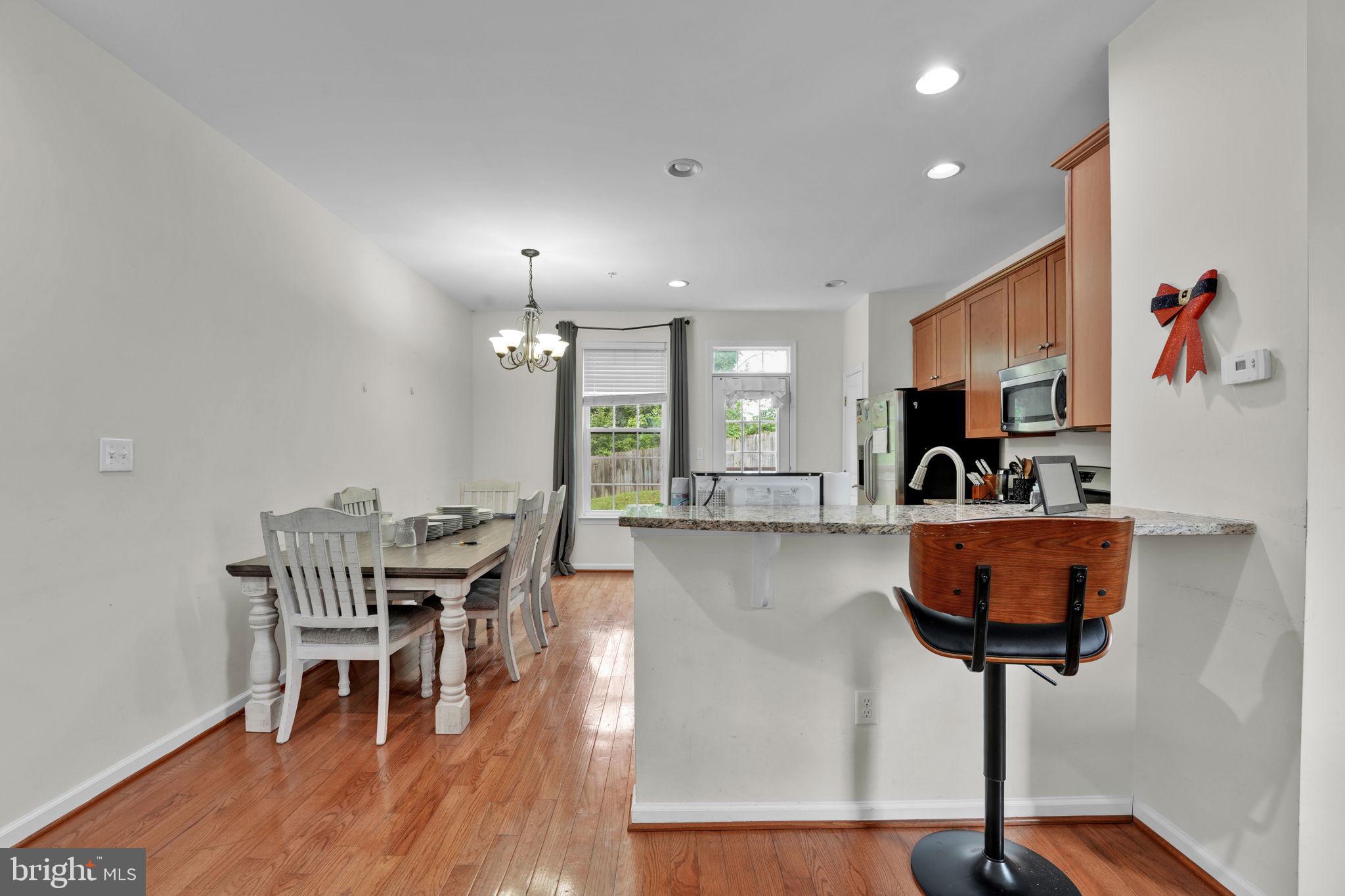 7138 Station House Road Elkridge, MD 21075 - Photo 22 of 42 a view of a room with furniture and wooden floor