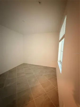 a view of an empty room and window