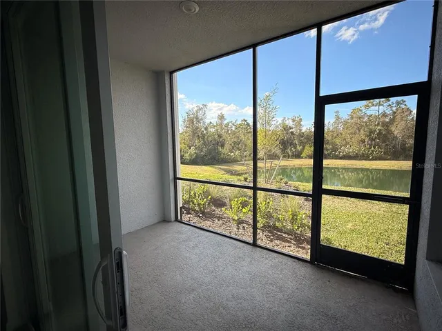 a view of an empty room with a large window