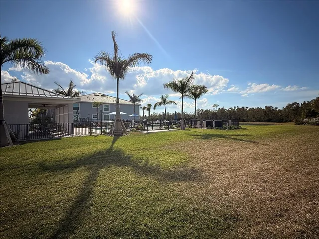 a view of a fountain in front of a house