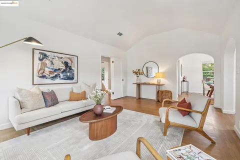 a dining room with furniture a window and a chandelier