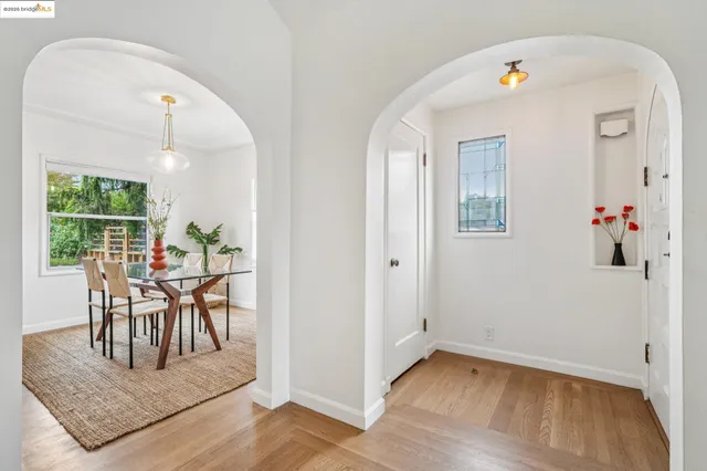 a view of a dining room with furniture window and wooden floor
