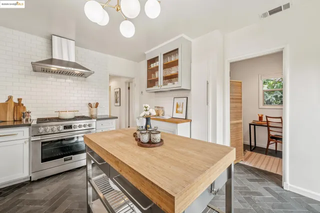 a bedroom with a bed and a potted plant
