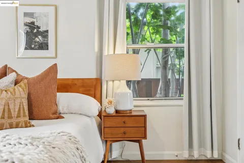 a kitchen with a refrigerator a sink and chairs