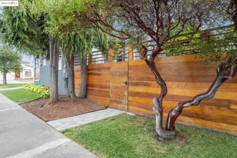a front view of a house with large windows