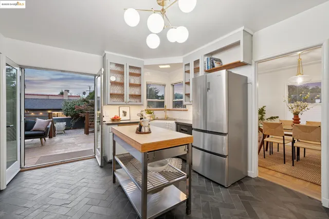 a view of a patio with a table and chairs