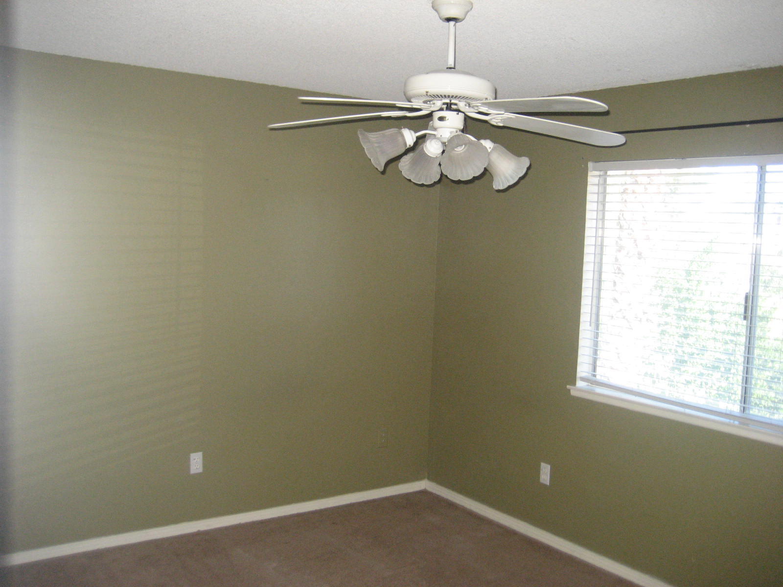 72724 Eagle Road, Unit 2 Palm Desert, CA 92260 - Photo 13 of 29 a view of a room with a hanging light and hardwood