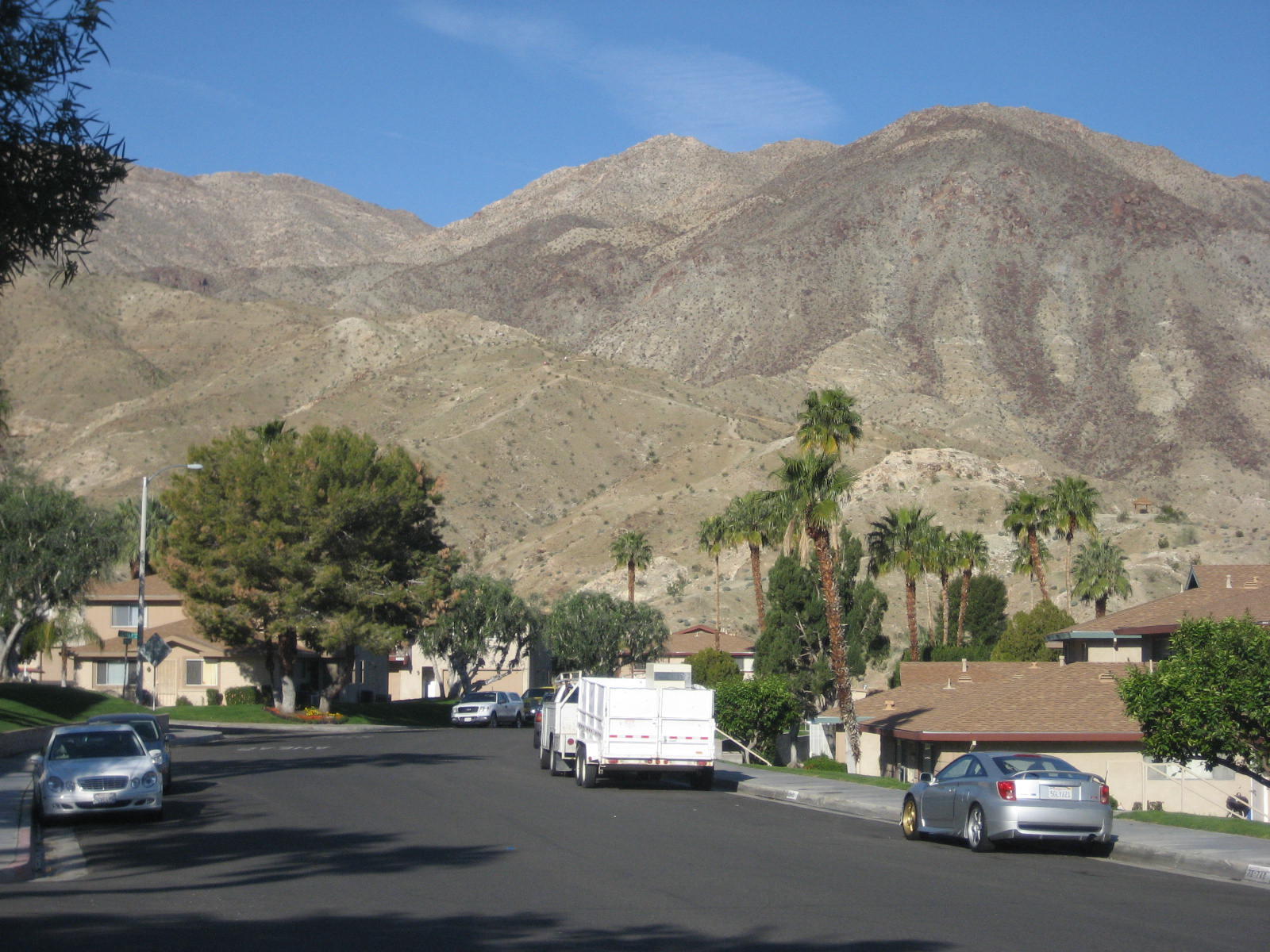 72724 Eagle Road, Unit 2 Palm Desert, CA 92260 - Photo 21 of 29 a car parked on the side of the road