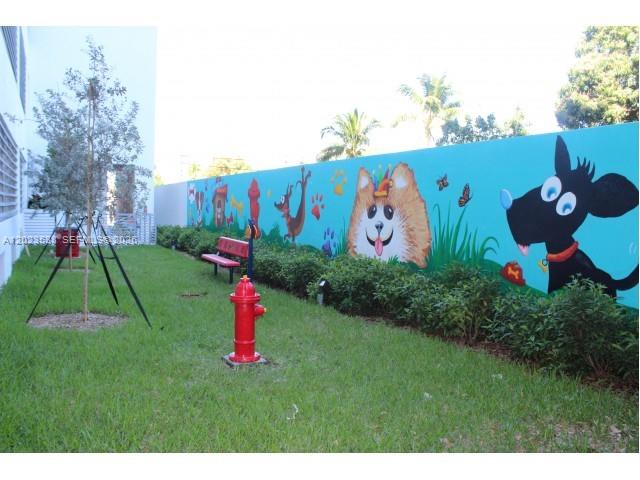 729 Northwest 2nd Street, Unit 920 Miami, FL 33128 - Photo 5 of 9 a view of a park with welcome board