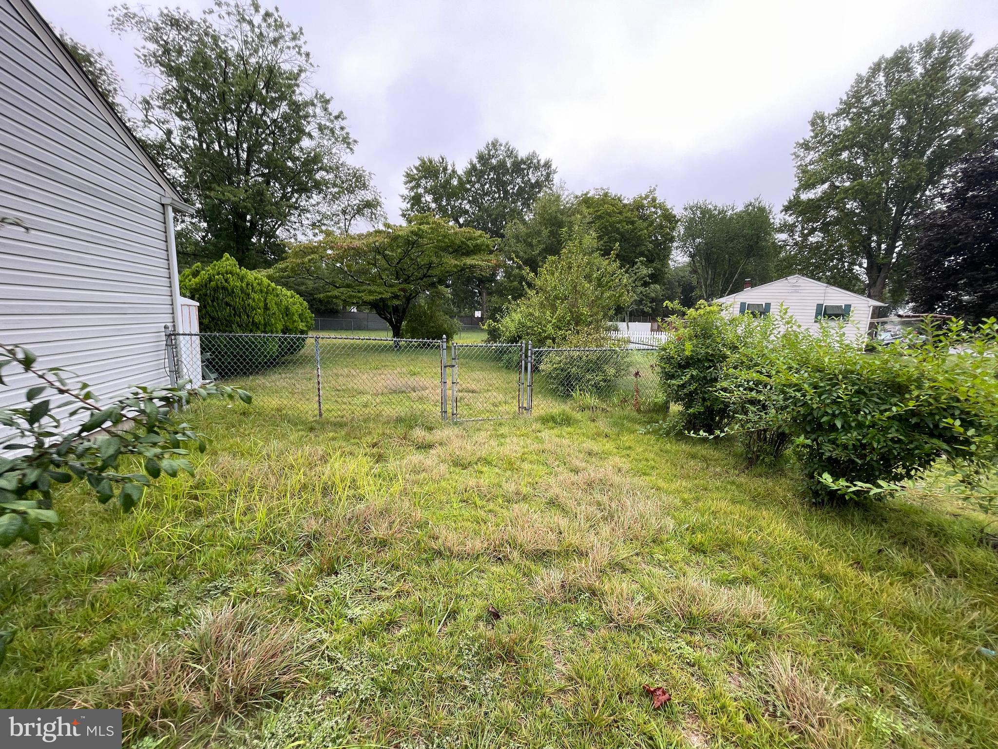 20 Castle Court Pemberton, NJ 08068 - Photo 2 of 18 a backyard of a house with lots of green space