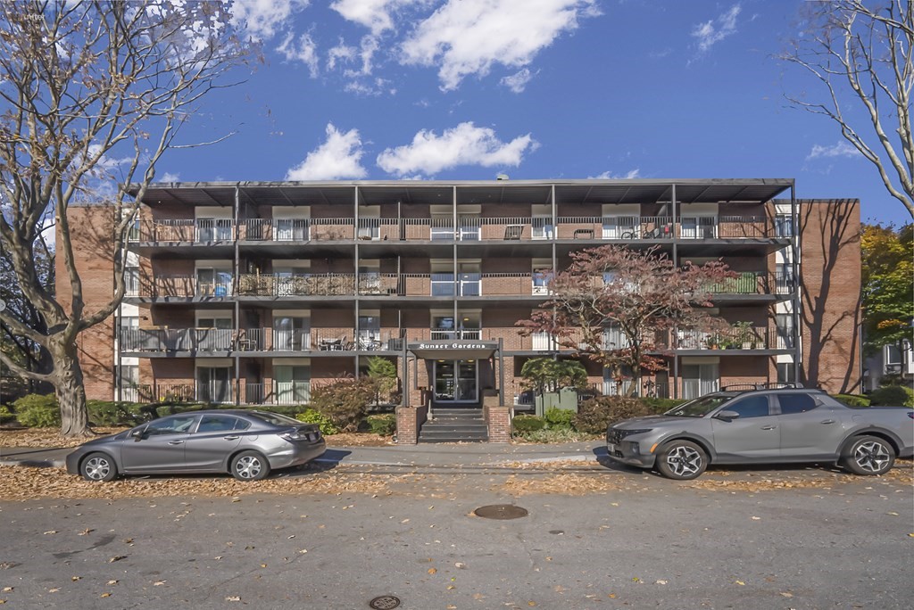 45 Oval Road, Unit 12 Quincy, MA 02170 - Photo 11 of 12 a car parked in front of a building