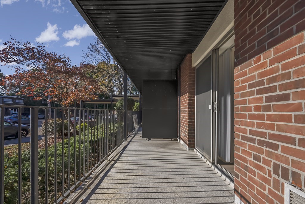 45 Oval Road, Unit 12 Quincy, MA 02170 - Photo 8 of 12 a path view of a house with a balcony